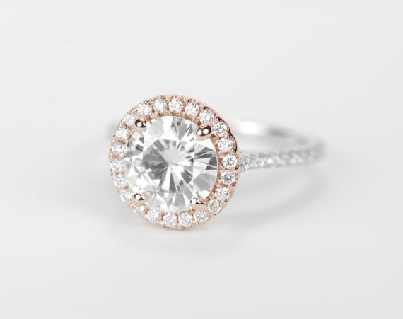 White gold engagement ring with rose gold halo