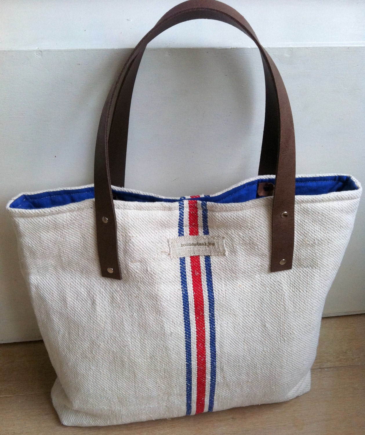 antique linen shoulder bag with red blue stripes and leather