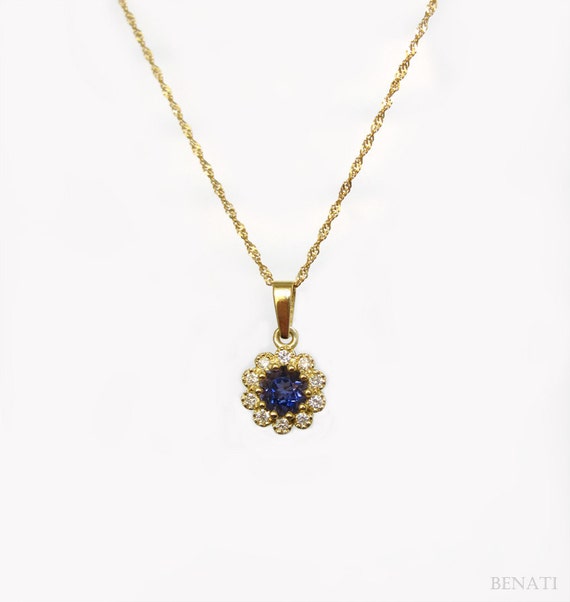 Gold flower setted with diamonds and Iolite Diamond by Benati