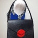 Vintage Louis Vuitton rare epi mod purse with red circle beak flap. very chic and mod