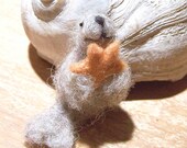 Tiny seal with starfish