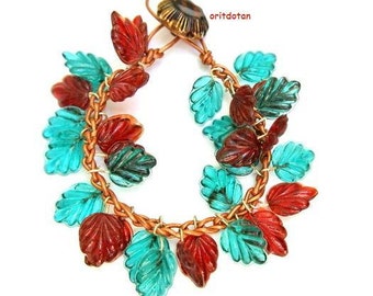 Bracelet button jewelry made of vintage glass leaves on knitted leather cord with vintage glass button