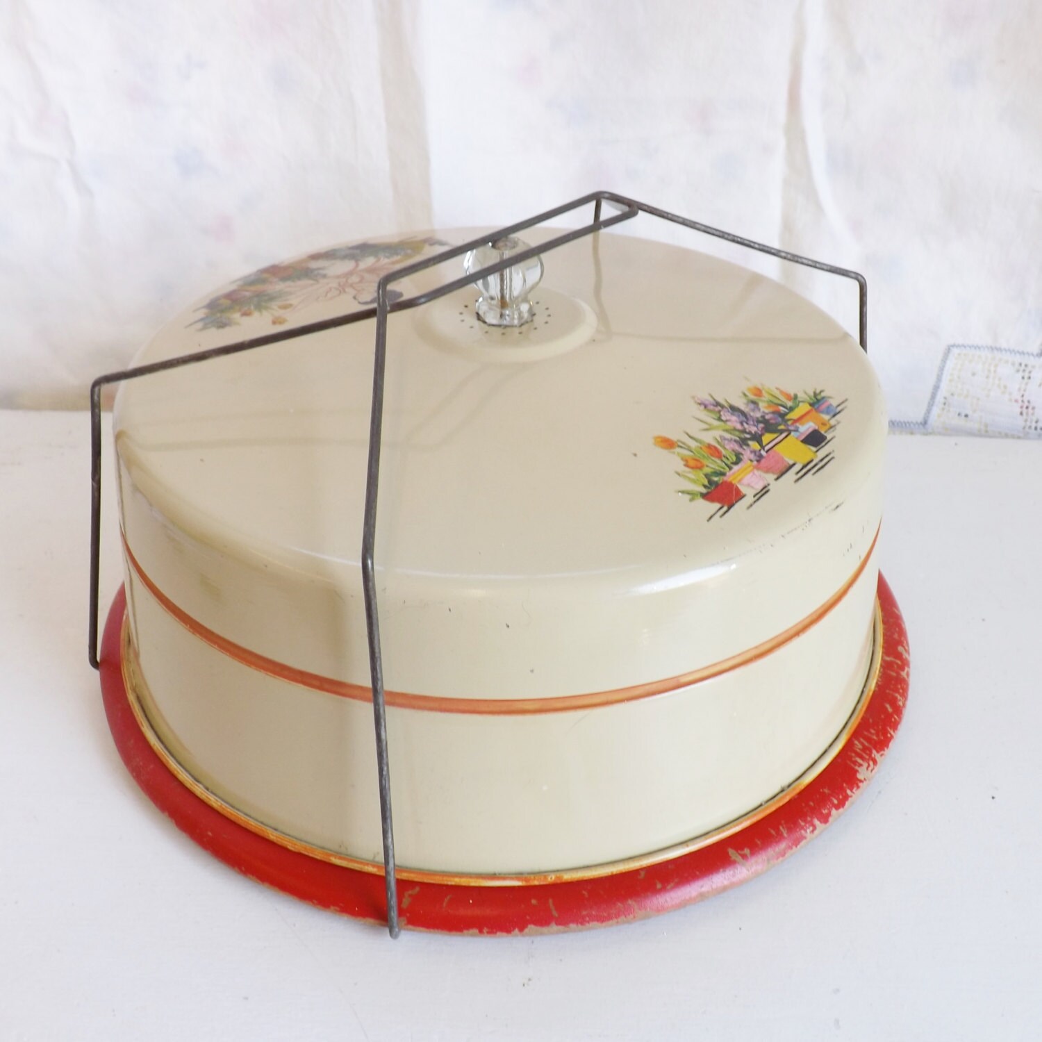 Vintage metal cake carrier with flowers and lady gardening
