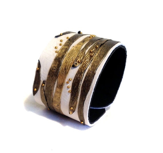 Stylish leather bracelet with gold leather straps. by julishland