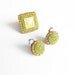 Mini circular earrings & ring in olive green, beige, and brown tones.