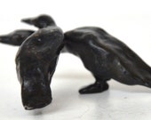 small bronze birds