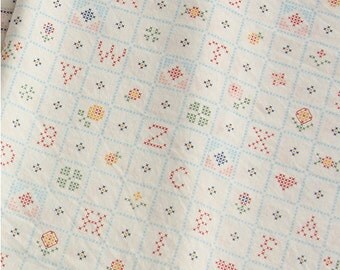 Housse de couette Alphabet point de croix avec un texte d'exemple