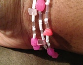 Three piece pink and white bracelet set
