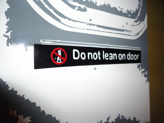 Do Not Lean Subway Train door vinyl on 8x10 wood block