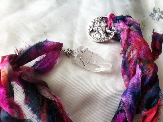 dulcina. a beautiful wire wrapped quartz point on recycle sari ribbon.