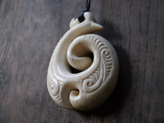 Whale bone double Koru spiral hand carved Maori pendant