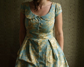 Floral toile button down peter pan collar dress with cap sleeves, pockets, and attached petticoat- made to measure