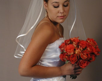 Wedding veil 22" past shoulder with folded satin ribbon. Bridal veil with folded satin ribbon.