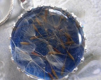 True Blue Background with Wispy Dandelion Seeds Crown Pendant Beneath Glass-Ride The Wind-Gifts Under 25-Symbolizes Happiness, Affection