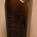 c1880s P. Loopuyt & Co. Distillers Schiedam Cork Top Blown Glass Case Gin Bottle with an Applied Lip