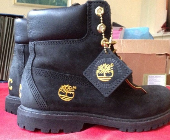black timbs with gold