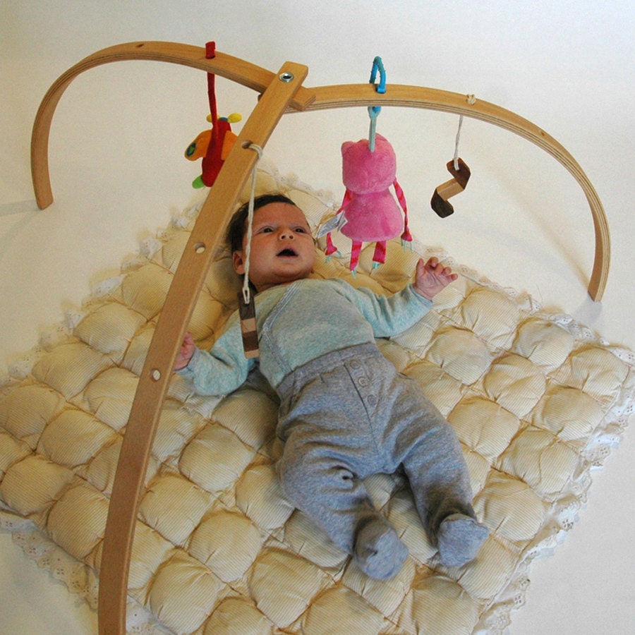 Wooden baby gym for hanging toys and mobiles. Natural wooden