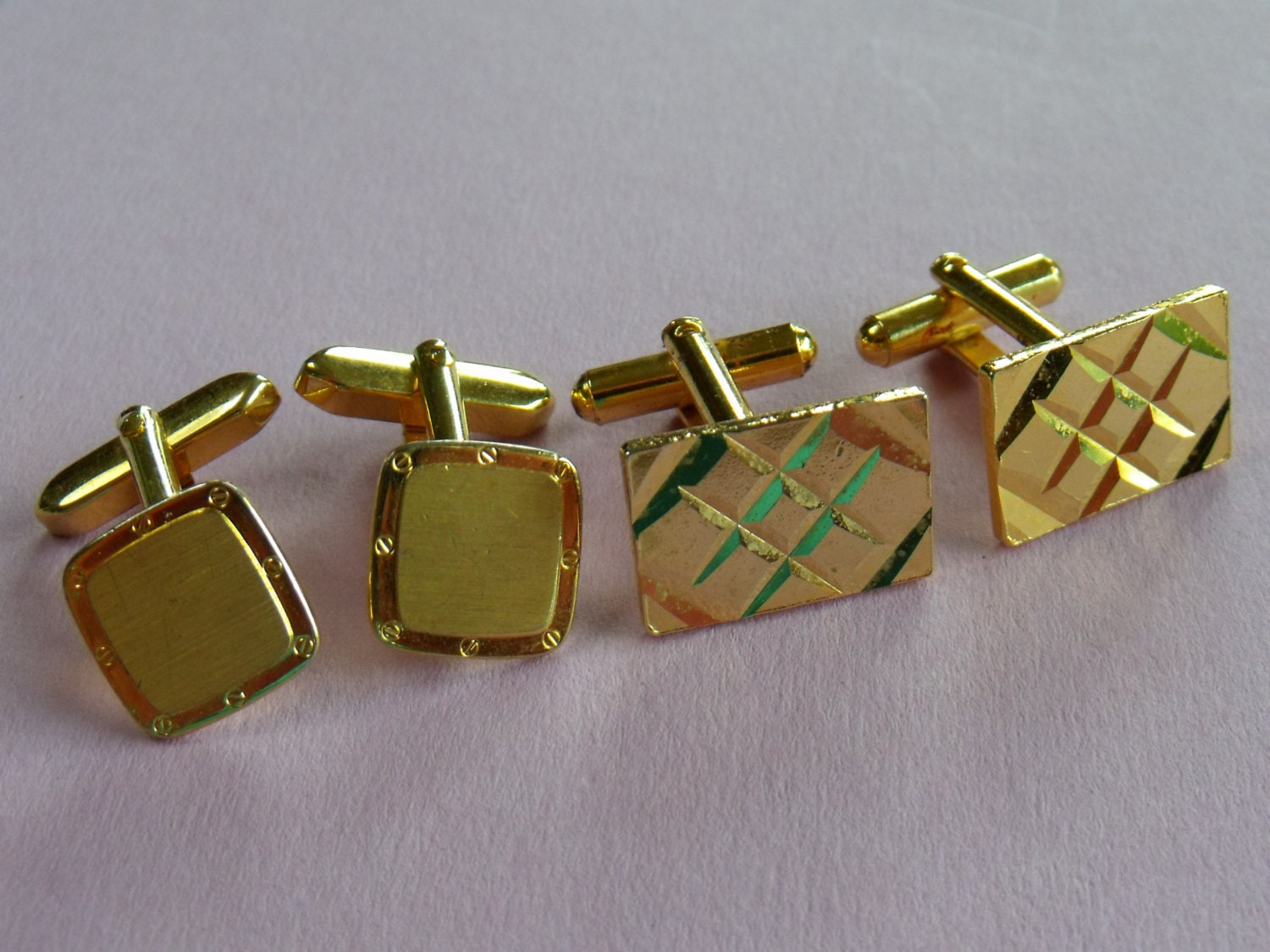Two fine pair of men’s vintage cufflinks in goldtone metal with various