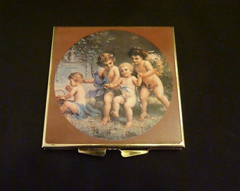 Vintage compact mirror with cherubs powder compact