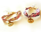 Gold Peace Charm Bracelet with Liberty Flower Ribbon