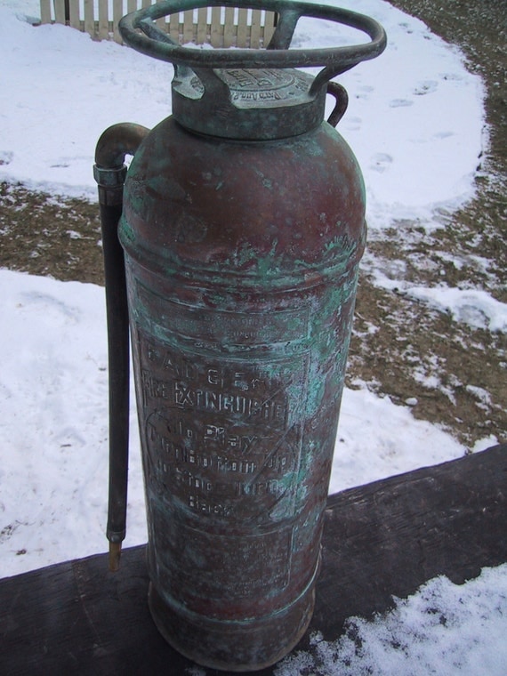 Antique Badger Fire Extinguisher with extensive patina