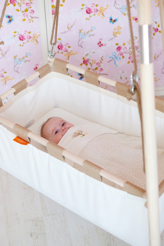 Hanging baby cradle on a spring from natural by Hangingcradles