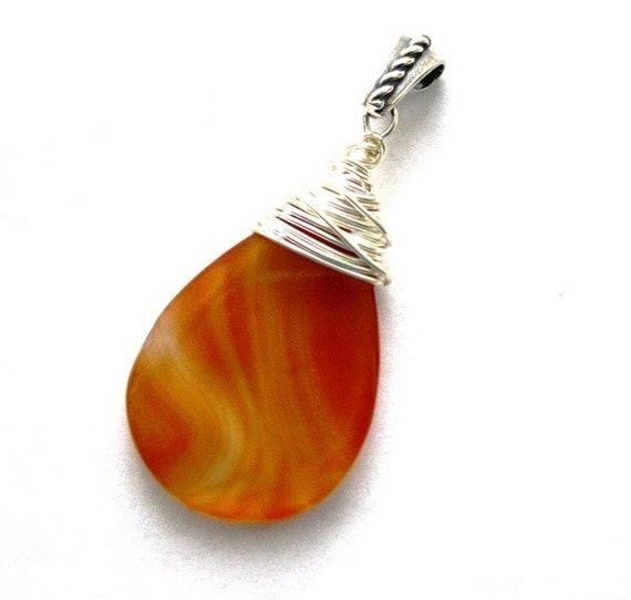 https://www.etsy.com/ie/listing/176714590/large-teardrop-pendant-wire-wrapped-in?ref=shop_home_active_2