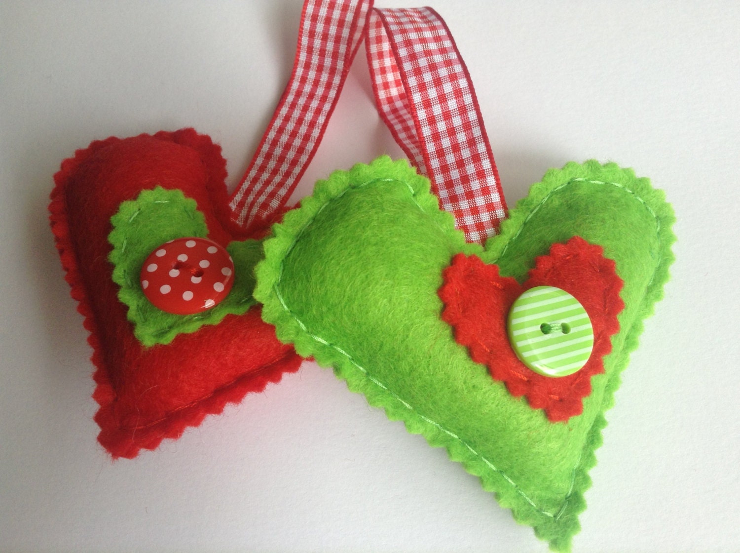 Two pack of handmade felt Christmas decorations in red and green contrasting colours