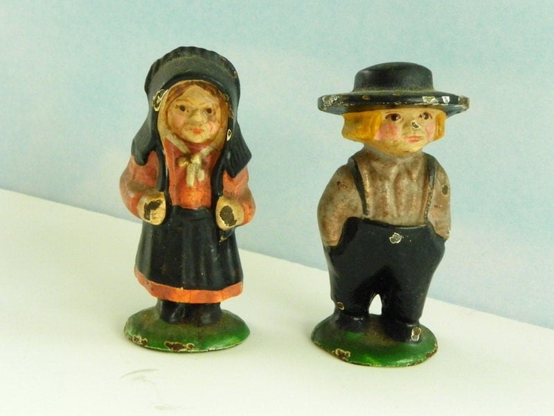 Antique Cast Iron Amish Girl and Boy. Small Cast Iron Toy