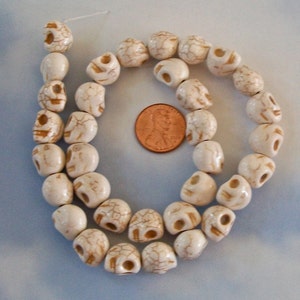 Tiny Cream Colored Howlite Stone Skull Beads Strand