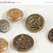Six Strange Metal Buttons SALE PRICE