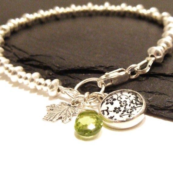 https://www.etsy.com/uk/listing/177666652/sterling-silver-bead-bracelet-with-oak?ref=shop_home_active_1