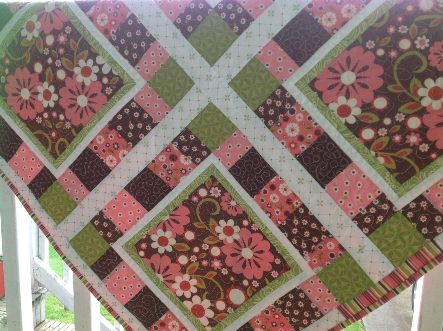 brown-and-pink-flowered-baby-quilt