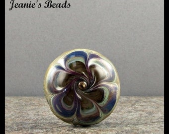 A handmade lampwork glass button with 2 shanks