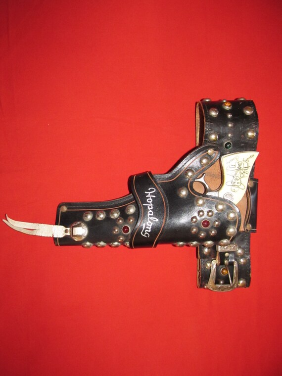 Hopalong Cassidy holster and toy cap gun. They are in