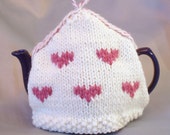 Tea cosy / teapot cover hand-knitted in pure wool. Pink heart, cream cozy