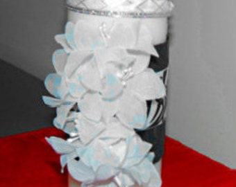 unity candle embellished with black and white damask ribbon and silk flowers