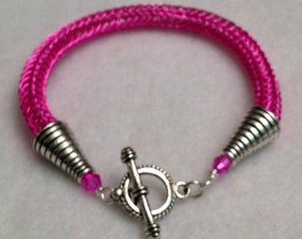 Vivacious pink viking knit ladies bracelet
