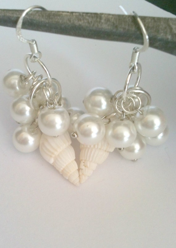 Bridal earrings with white glass pearl and shell in a cluster style.