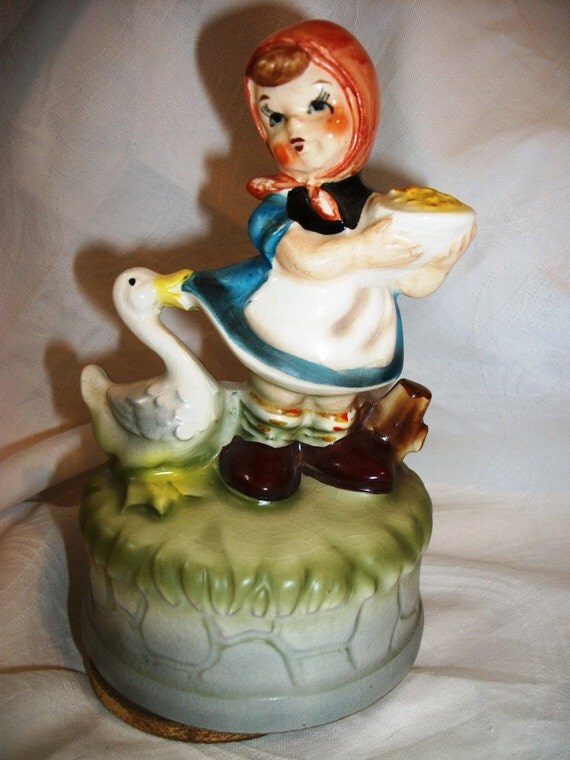 Vintage Figurine of a MUSICAL GIRL feeding her GOOSE Plays