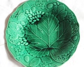 Majolica green plate with vine leaf and strawberry design. George Jones stamp