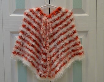 KNITTED GIRL'S PONCHO, 3 to 4 years old, hand knitted poncho,made of a soft cuddlespun yarn,in white and orange heather