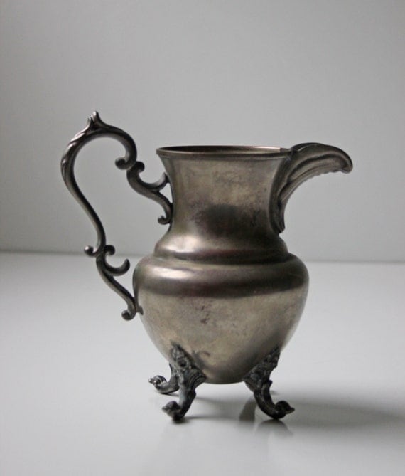 antique silver metal water pitcher