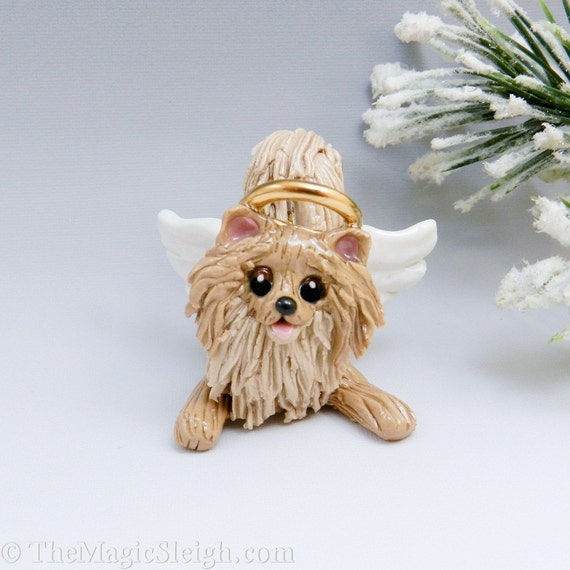 pomeranian statue with wings