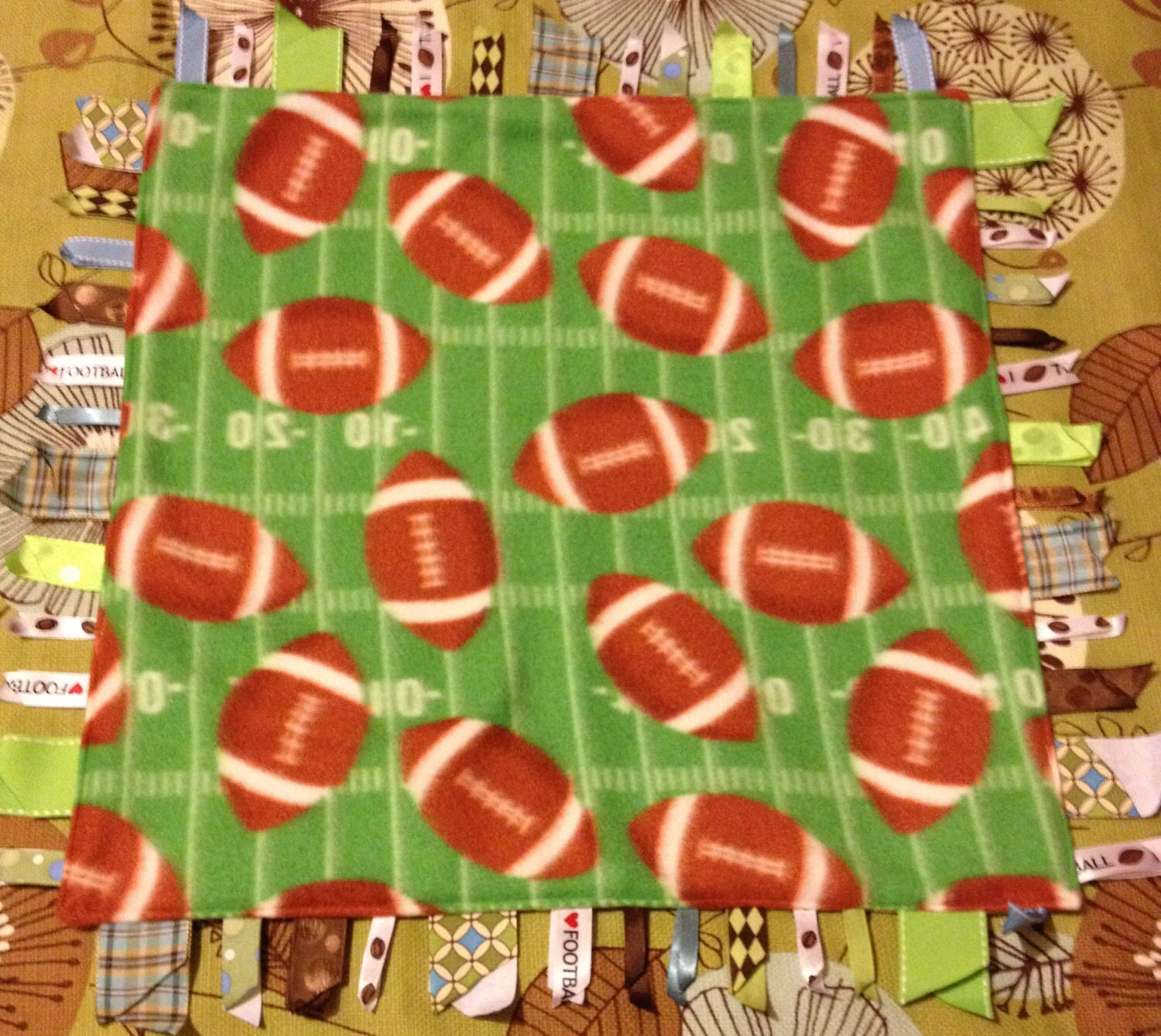 Football Fleece Blanket 18 square with Ribbons on each by dmbrohm