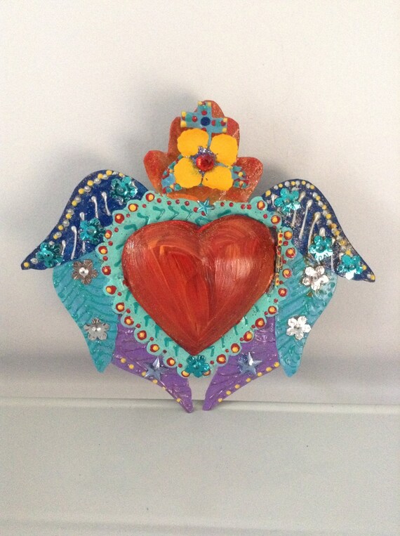 Mexican winged sacred heart tin nicho with heart door and