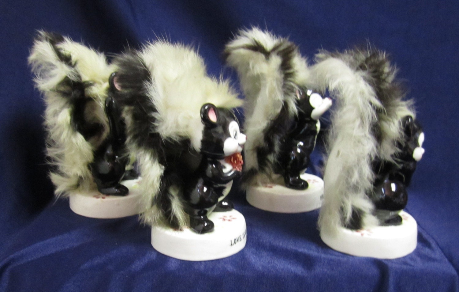 ceramic skunk figurines