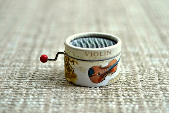 Music box Violin. Paper.