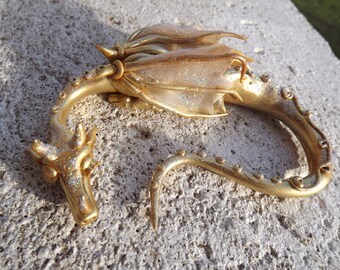 Little sleepy gold dragon