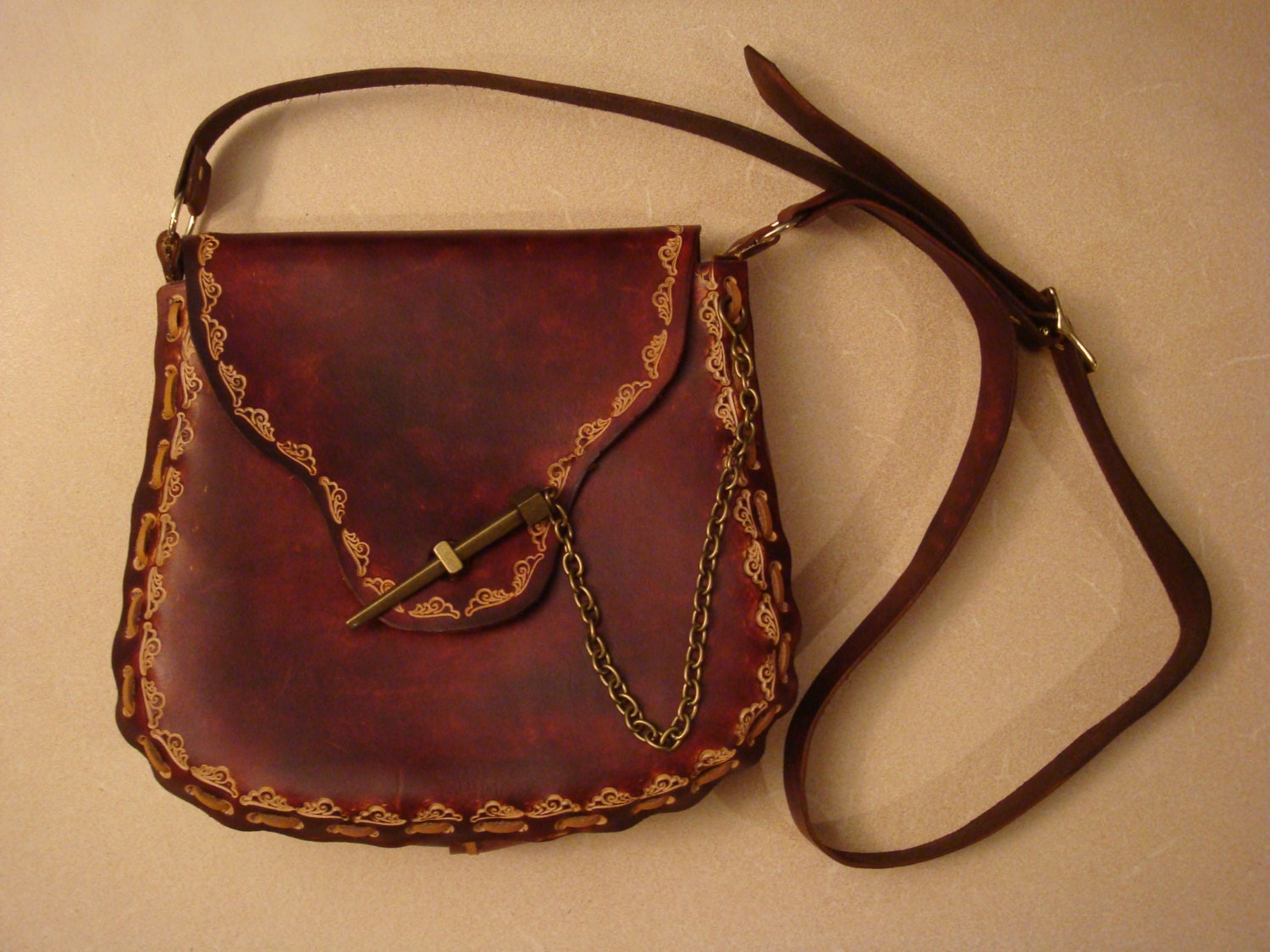 tooled leather crossbody bag